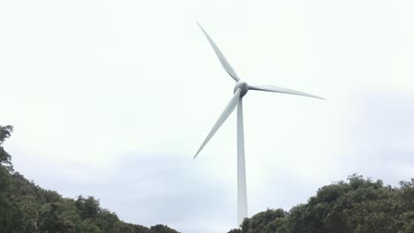 wind turbine generating sustainable electric energy in bad windy weather