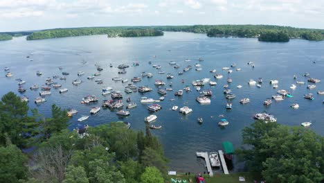 aerial, motor boats crowded on a lake during college spring summer break