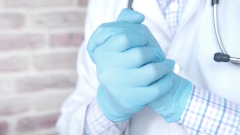 doctor putting on gloves