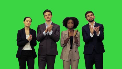 young people in official clothes applauding, showing their agreement with the speaker on a green screen, chroma key