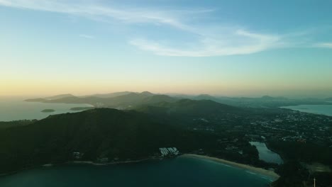 4K-Cinematic-nature-aerial-footage-of-a-drone-flying-over-the-beautiful-beaches-of-Promthep-Cape-in-Phuket,-Thailand-during-sunset