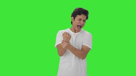 sick indian man having hand pain green screen