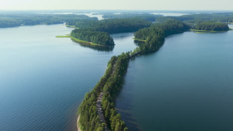 drone shot flying along the museotie road, summer in punkaharju, finland