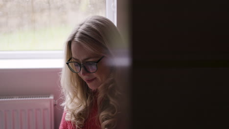 woman reading a book indoors