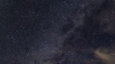 milky way and star time lapse with moving clouds, airplanes on clear night until dusk