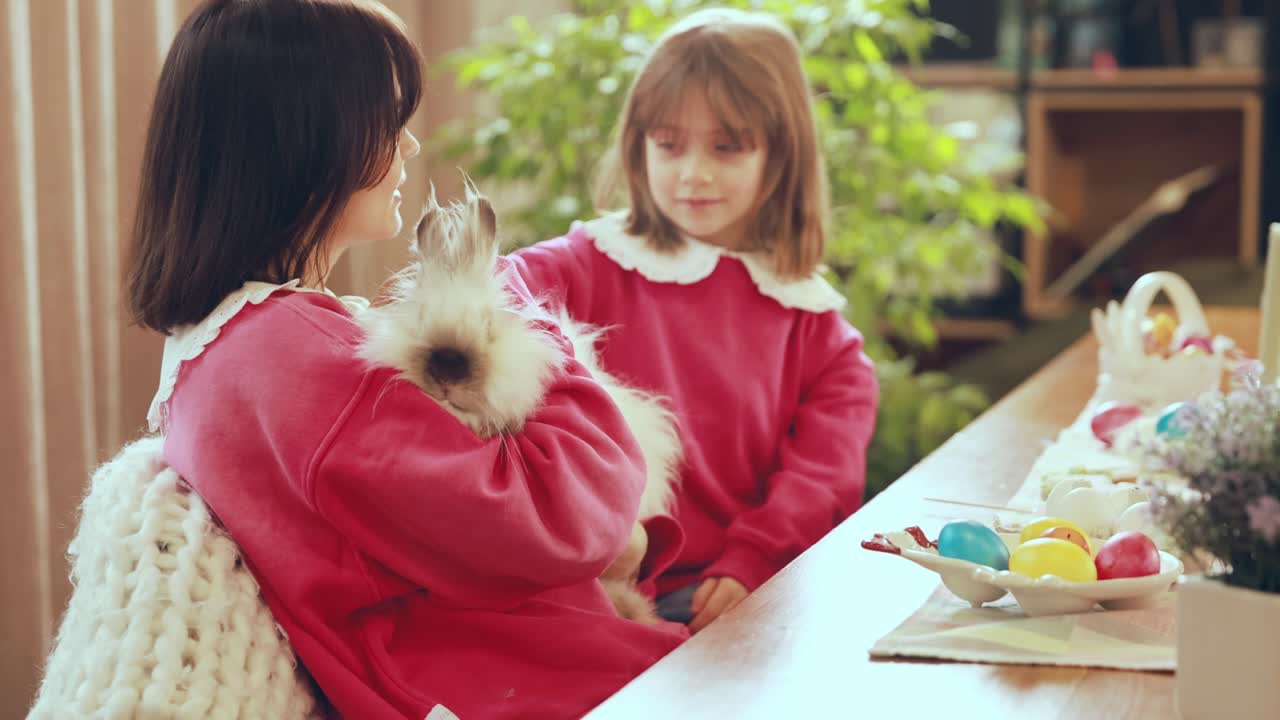 Mother and Daughter Bonding with a Easter Bunny