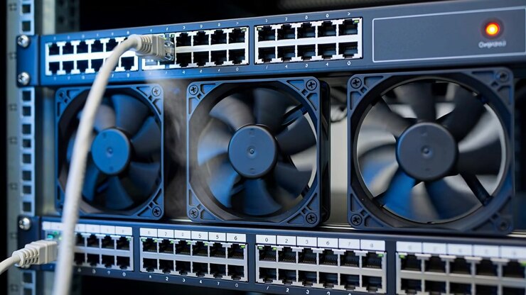 Powering rack, three fans spinning, keeping switches cool in server room, with white cable, lit LED