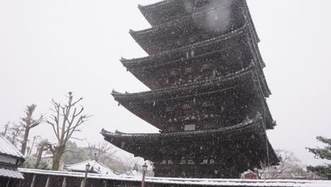 winter in japan, heavy snow falling over hokan-ji yasaka pagoda