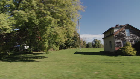 view from the side window of a car on a typical american suburb