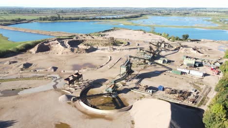 Tarmac-Quarry-Collingham,-Newark-on-Trent-aerial-view-pull-back-reveal-lakes-in-background