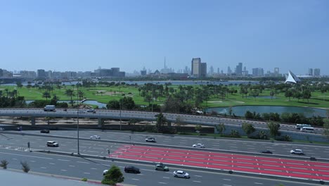 Dubai-skyline-from-Deira-with-a-view-of-Dubai-Golf-Course,-United-Arab-Emirates