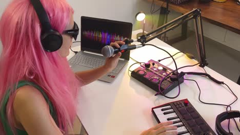 woman recording music in home studio