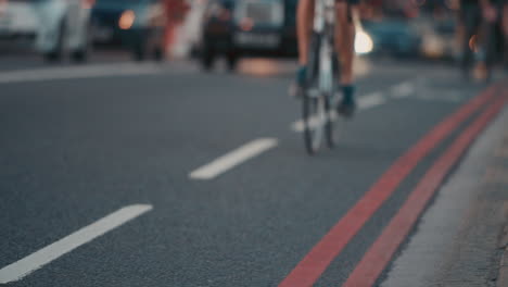 Anonymous-crowd-of-people-walking-cycling-bicycles-commuters-London-City-street-slow-motion