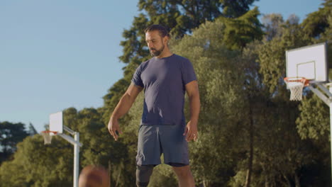 middle-aged hispanic man with prosthetic leg playing ball game