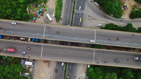 vehicles moving on flyover pull up drone shot at chennai bypass road, ambedkar nagar, kamaraj nagar, maduravoyal, chennai, tamil nadu, india. day time, 4k.