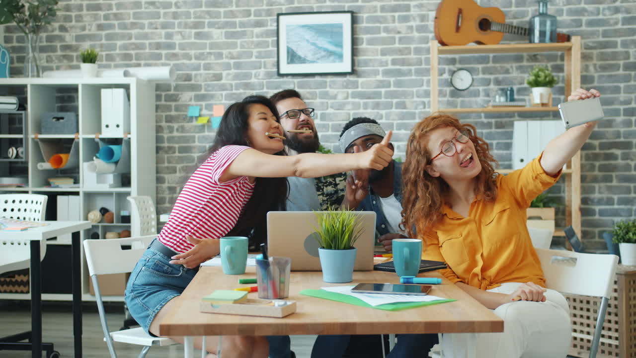 Happy Team Taking a Selfie in the Office