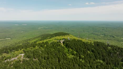 drone footage of a fire tower outlook in new hampshire with a beautiful view