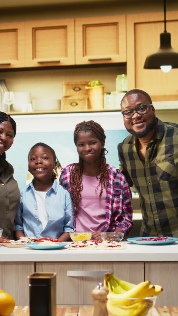 Vertical Video Portrait of parents teaching their kids how to make homemade pizza
