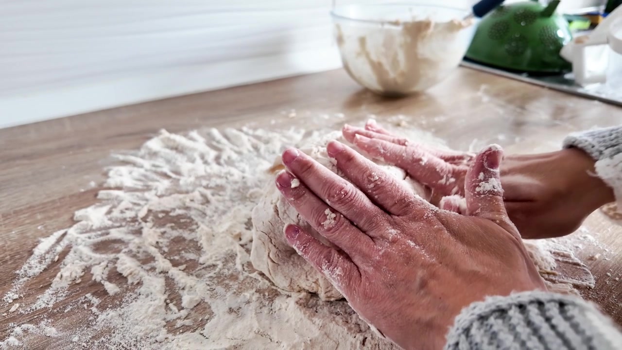 Kneading dough to make homemade bread