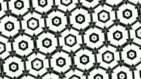 Animation-of-monochromatic-design-of-hexagons-arranged-symmetrically-in-rows-and-revolving,-on-white-background