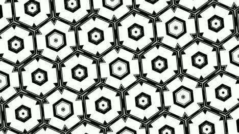 animation of monochromatic design of hexagons arranged symmetrically in rows and revolving, on white background