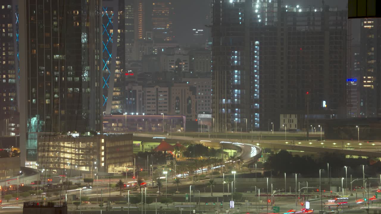 Dynamic time lapse of Abu Dhabi's illuminated bridges and skyline at night showcasing urban architecture and vibrant city life atmospheric lighting dynamic movement