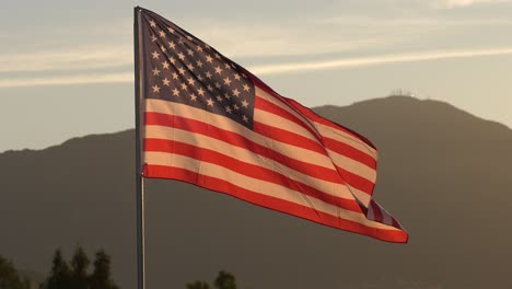 Patriotic-Sunrise:-American-Flag-in-Motion