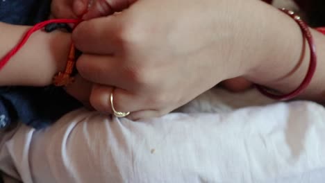 toddler baby boy excited to eat sweets on the occasion of raksha bandhan