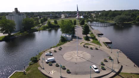 spinning pan rotation to show flag in the wind atop stone compass