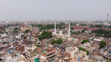 aerial view of a densely populated city with a mosque