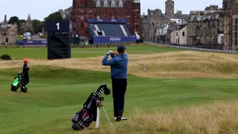 golfer swings on st andrews course