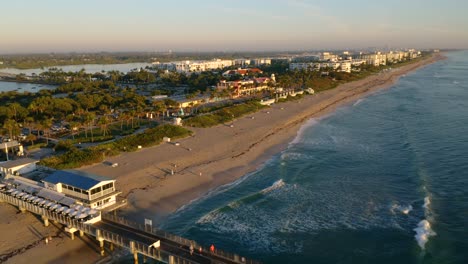 Drone-4K-video-heading-northwest-over-the-fishing-pier-at-Lake-Worth-Florida-at-sunrise