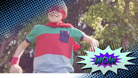 wow text on speech bubble against boy in superhero costume punching in the air