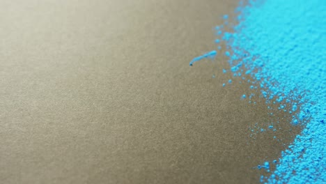 video of blue coloured powders with copy space on black background