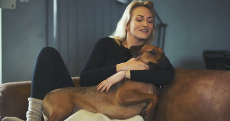 lifestyle woman playing with dog