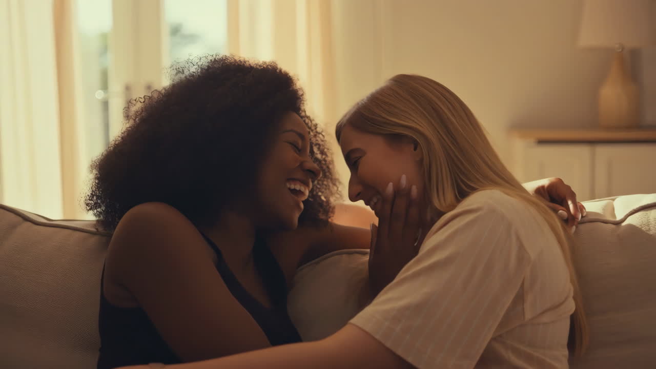 Affectionate Young Couple Sharing a Tender Moment on a Couch