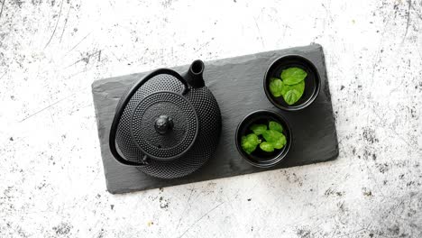 traditional eastern metal teapot and iron cups