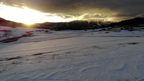 Stunning-sunset-shot-over-snowy-plains-and-gorgeous-mountains