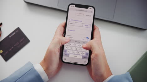 using a smartphone for online shopping with a promo code