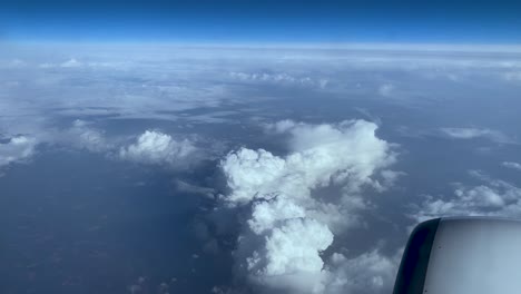 bright clouds and vast atmosphere view from a traveling airplane within oporto, portugal