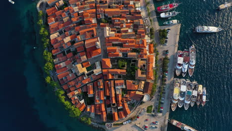 beautiful korčula old town and boat harbour in croatia, aerial top down view