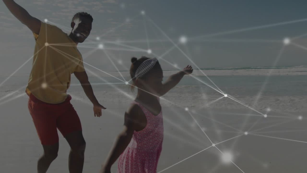 Dad and daughter running on beach, daughter leading, matching wings playing, tech overlay animating