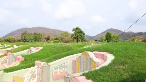 pan across a peaceful, colorful cemetery landscape