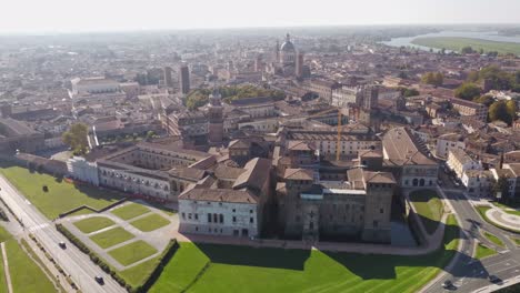 establishing aerial shot of historical city of mantua with view of old town