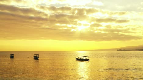 traditional balinese fishing boats floating on the calm sea