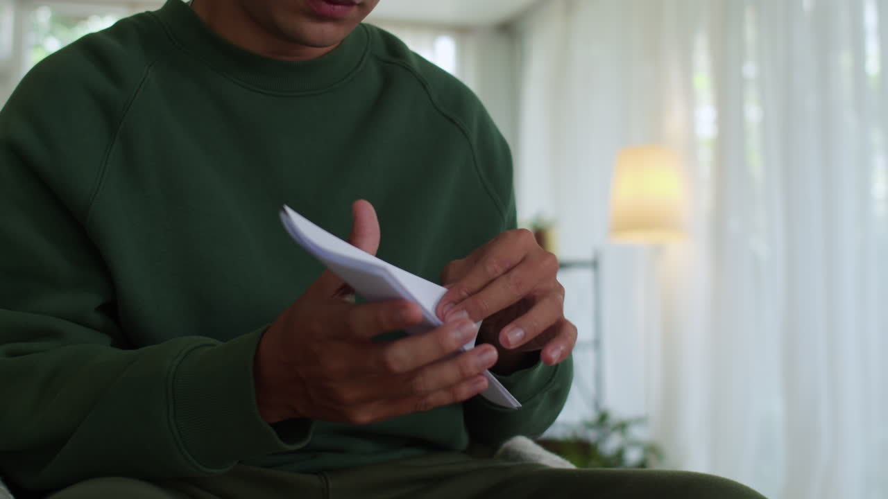 Sad man reading letter