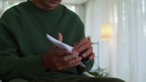 sad man reading letter