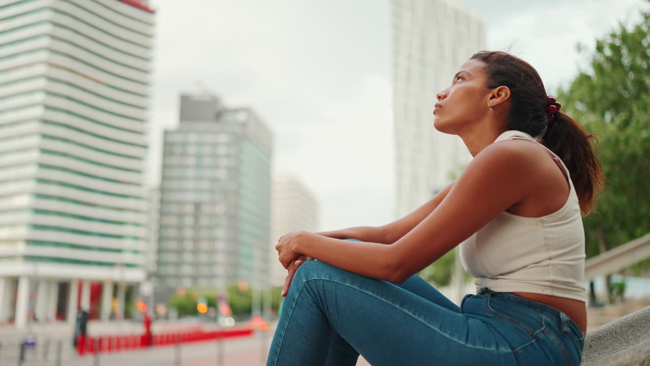 Woman sitting in an urban environment