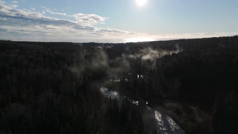 foggy-morning-over-some-trees-and-a-river-shot-by-drone-in-4K-60FPS