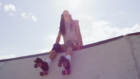 man roller skating at skatepark